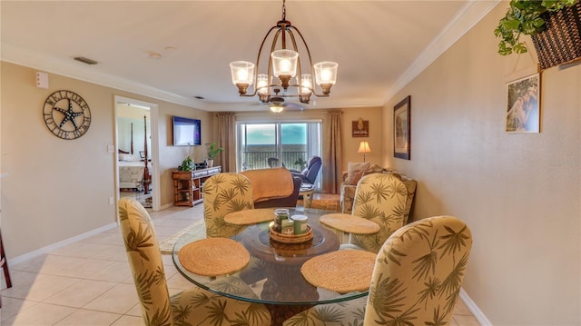 dining room with light tile patterned floors, baseboards, ornamental molding, visible vents, and a chandelier