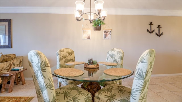 dining space with crown molding, a notable chandelier, baseboards, and light tile patterned floors