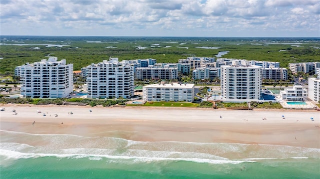 aerial view featuring a water view and a view of the beach