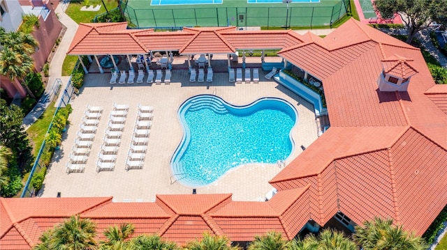 community pool featuring a patio area