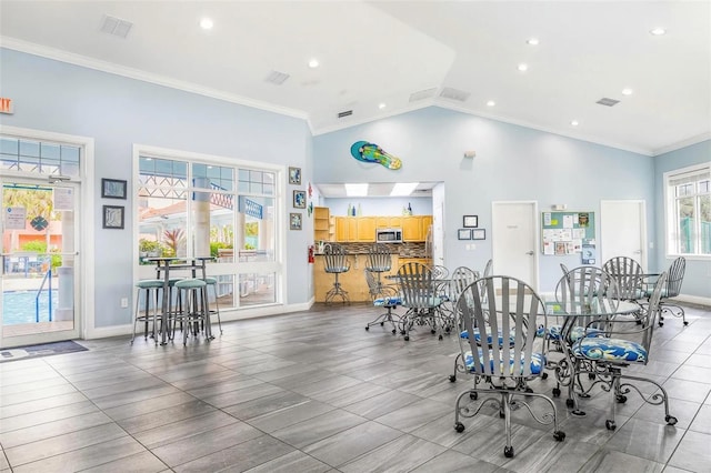 dining area featuring baseboards, ornamental molding, visible vents, and recessed lighting