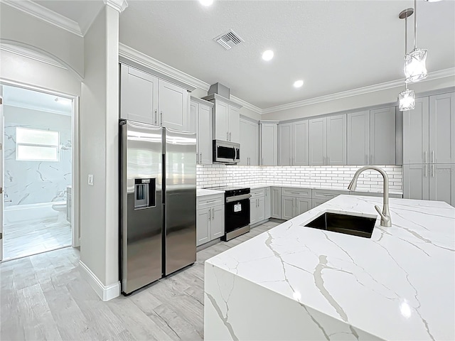 278 Acorn Dr, Longwood, FL 32750 - kitchen with visible vents, a sink, crown molding, decorative backsplash, and appliances with stainless steel finishes