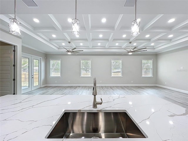 278 Acorn Dr, Longwood, FL 32750 - kitchen with light wood-type flooring, light stone countertops, open floor plan, and a sink
