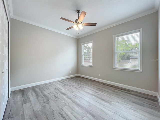 278 Acorn Dr, Longwood, FL 32750 - unfurnished room featuring a ceiling fan, wood finished floors, baseboards, and ornamental molding