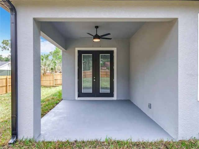 278 Acorn Dr, Longwood, FL 32750 - entrance to property featuring fence, french doors, a patio, stucco siding, and a ceiling fan