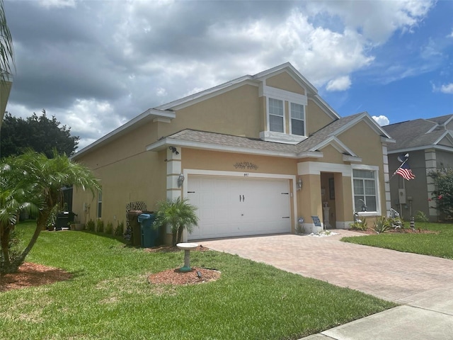 447 Cadiz Loop, Davenport, FL 33837 - craftsman inspired home featuring a shingled roof, stucco siding, decorative driveway, and a front yard