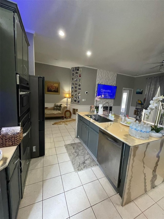 447 Cadiz Loop, Davenport, FL 33837 - kitchen with a sink, light tile patterned flooring, black appliances, light countertops, and open floor plan