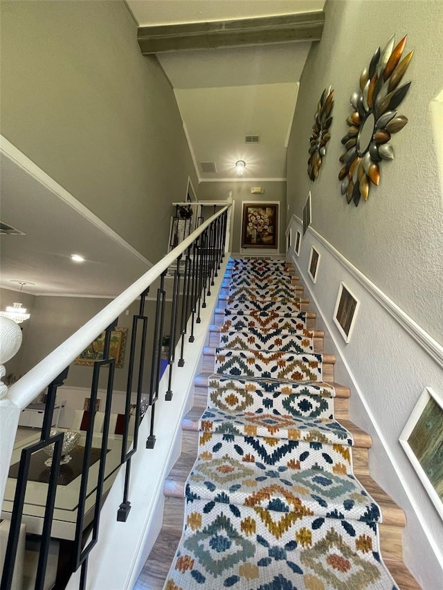 447 Cadiz Loop, Davenport, FL 33837 - stairway featuring visible vents, a textured wall, and wood finished floors