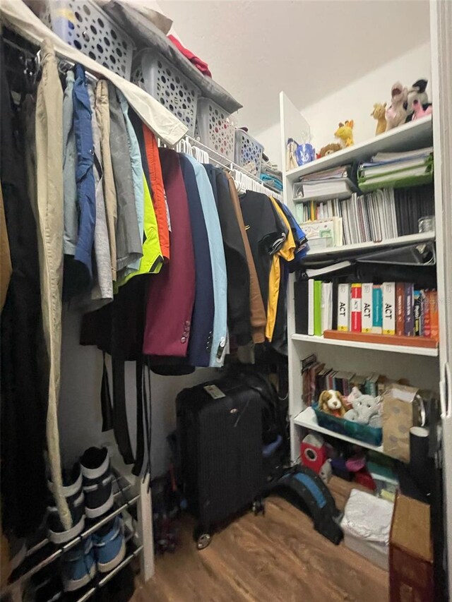 447 Cadiz Loop, Davenport, FL 33837 - walk in closet with wood finished floors