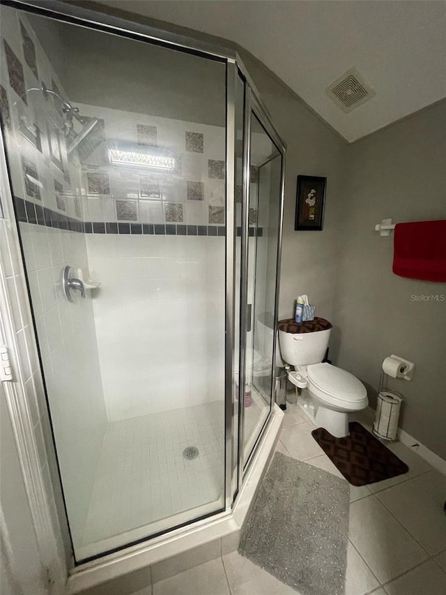 447 Cadiz Loop, Davenport, FL 33837 - bathroom with toilet, a stall shower, visible vents, baseboards, and tile patterned flooring