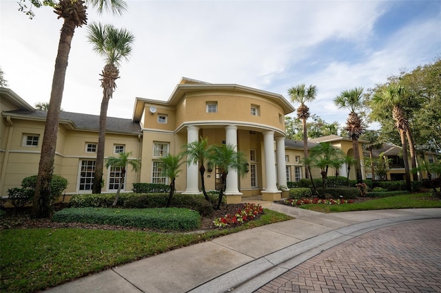 2652 Robert Trend Jones Unit 2652, Orlando, FL 32835 - view of front of home featuring a porch and stucco siding