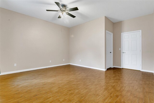2975 White Cedar Cir, Kissimmee, FL 34741 - spare room with light wood-style floors and a ceiling fan