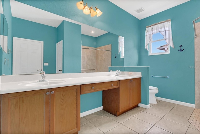 2975 White Cedar Cir, Kissimmee, FL 34741 - bathroom featuring double vanity, tiled shower, and tile patterned flooring