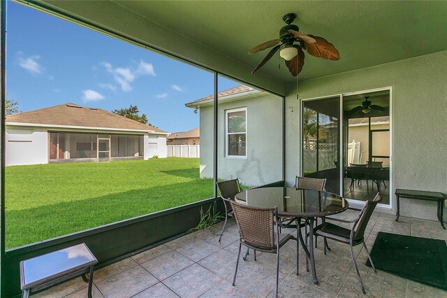 2975 White Cedar Cir, Kissimmee, FL 34741 - sunroom with ceiling fan and outdoor dining space