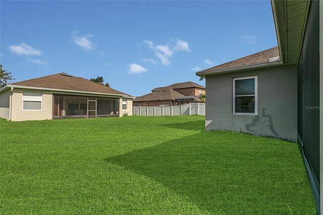 2975 White Cedar Cir, Kissimmee, FL 34741 - view of yard with a sunroom