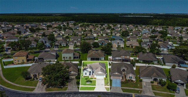 2975 White Cedar Cir, Kissimmee, FL 34741 - aerial view of property's location featuring property boundaries highlighted and nearby suburban area