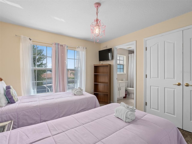 bedroom featuring ensuite bath