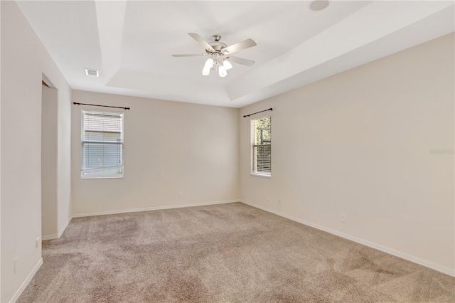 626 Green Rock Ct, Apopka, FL 32712 - spare room with a tray ceiling, light colored carpet, and ceiling fan