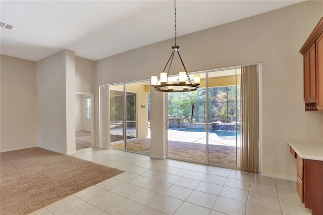 626 Green Rock Ct, Apopka, FL 32712 - unfurnished dining area featuring a chandelier, healthy amount of natural light, and light tile patterned floors