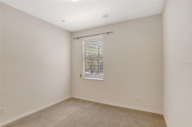 626 Green Rock Ct, Apopka, FL 32712 - empty room with light colored carpet