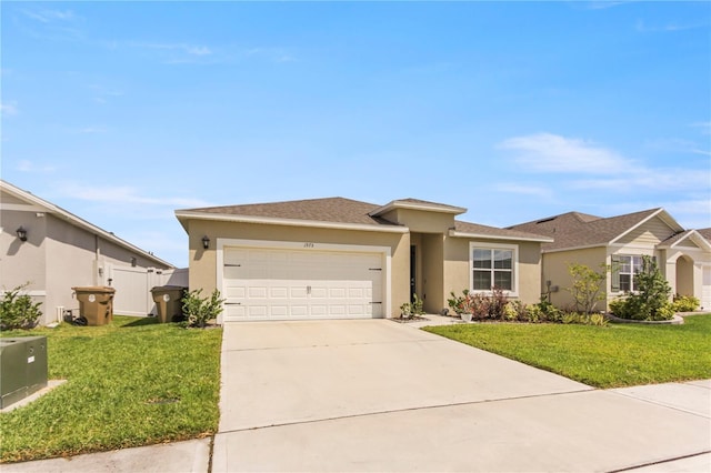 1975 Cacutta Way, Kissimmee, FL 34744 - view of front facade with a garage, stucco siding, a front yard, and concrete driveway