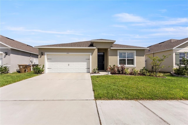 1975 Cacutta Way, Kissimmee, FL 34744 - view of front of house with a garage, stucco siding, concrete driveway, and a front lawn