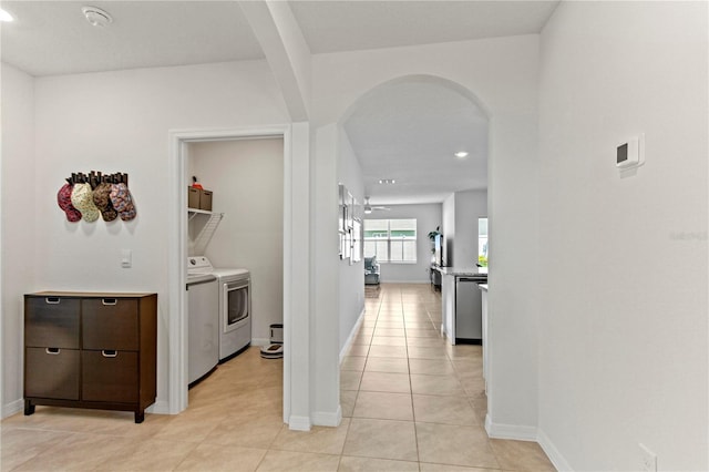 1975 Cacutta Way, Kissimmee, FL 34744 - hall featuring washing machine and clothes dryer, arched walkways, recessed lighting, and baseboards