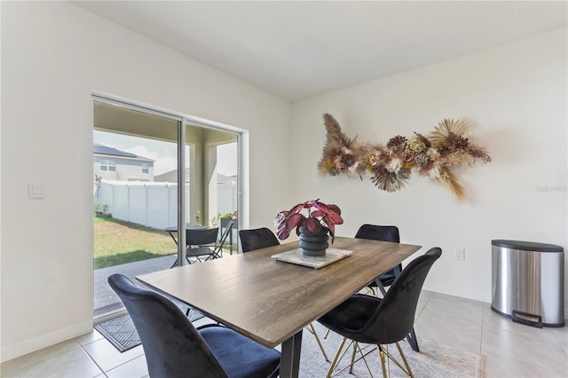 1975 Cacutta Way, Kissimmee, FL 34744 - dining room featuring light tile patterned floors and baseboards