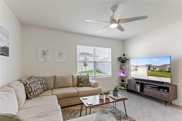 1975 Cacutta Way, Kissimmee, FL 34744 - living area featuring ceiling fan, baseboards, and light tile patterned flooring