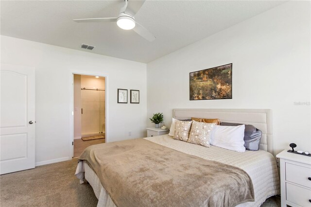 1975 Cacutta Way, Kissimmee, FL 34744 - carpeted bedroom featuring ensuite bathroom, baseboards, and ceiling fan