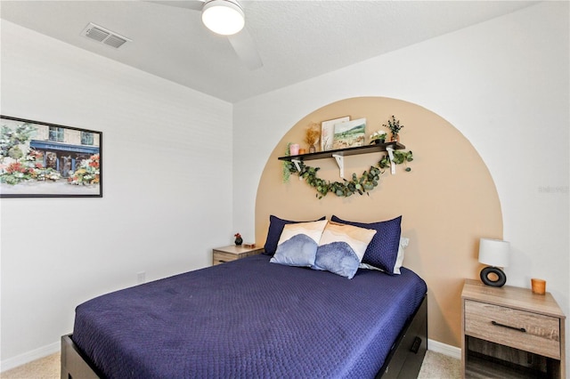 1975 Cacutta Way, Kissimmee, FL 34744 - bedroom with light carpet, baseboards, and a ceiling fan