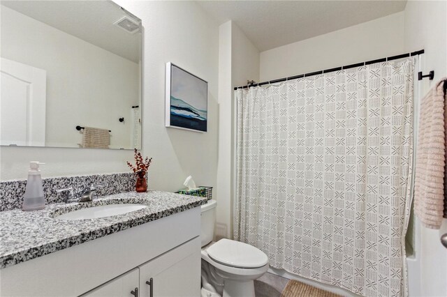 1975 Cacutta Way, Kissimmee, FL 34744 - bathroom with toilet and vanity