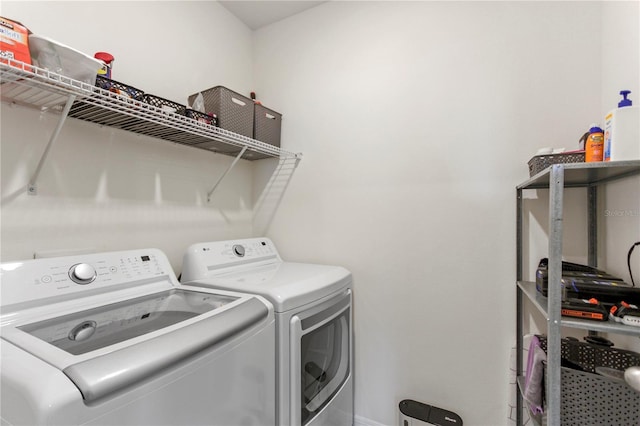 1975 Cacutta Way, Kissimmee, FL 34744 - washroom with separate washer and dryer and baseboards