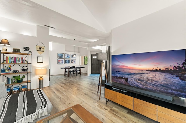 546 Via Fontana Dr Unit 203, Altamonte Springs, FL 32714 - living room featuring vaulted ceiling and hardwood / wood-style floors