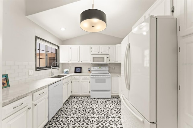546 Via Fontana Dr Unit 203, Altamonte Springs, FL 32714 - kitchen with white appliances, a sink, white cabinetry, vaulted ceiling, and tasteful backsplash