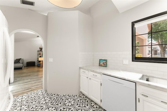 546 Via Fontana Dr Unit 203, Altamonte Springs, FL 32714 - interior space with a sink, white appliances, visible vents, decorative backsplash, and arched walkways