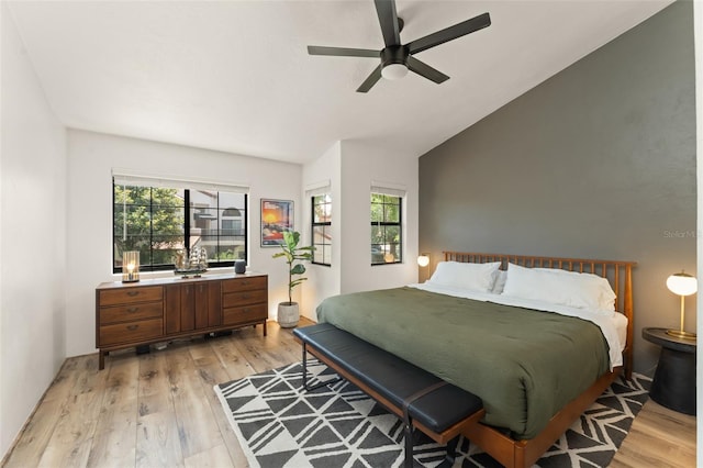 546 Via Fontana Dr Unit 203, Altamonte Springs, FL 32714 - bedroom with multiple windows, light wood-style flooring, and ceiling fan