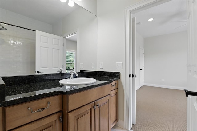 bathroom featuring vanity and baseboards