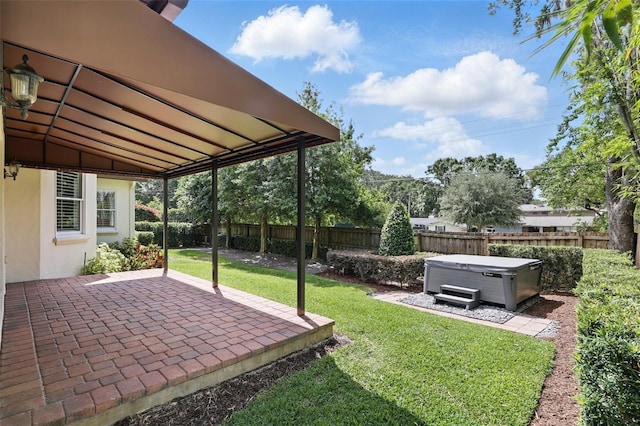view of yard with a hot tub and a patio