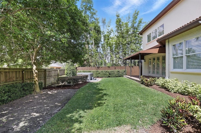 view of yard featuring french doors