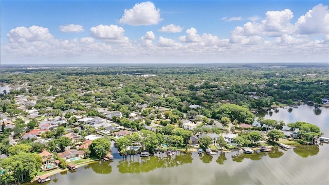 aerial view of residential area featuring a large body of water