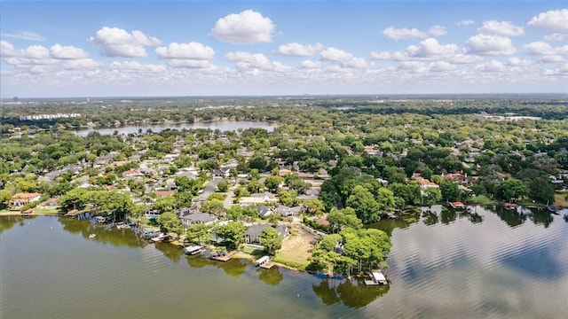aerial view of residential area featuring a nearby body of water