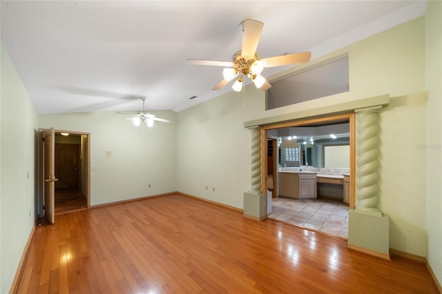 4265 Conway Place Cir, Orlando, FL 32812 - unfurnished living room with lofted ceiling, a ceiling fan, light wood-style flooring, and baseboards
