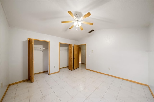 4265 Conway Place Cir, Orlando, FL 32812 - unfurnished bedroom with multiple closets, baseboards, vaulted ceiling, light floors, and a ceiling fan