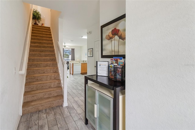 7663 Fitzclarence St, Kissimmee, FL 34747 - stairs featuring wood tiled floors and baseboards