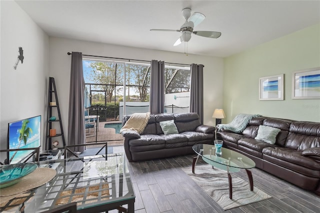 7663 Fitzclarence St, Kissimmee, FL 34747 - living area with plenty of natural light, a ceiling fan, and wood finished floors