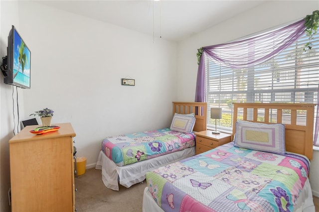 7663 Fitzclarence St, Kissimmee, FL 34747 - carpeted bedroom with baseboards