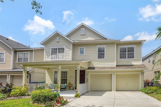 14231 Sonco Ave, Windermere, FL 34786 - view of front facade with a porch, an attached garage, concrete driveway, and a shingled roof