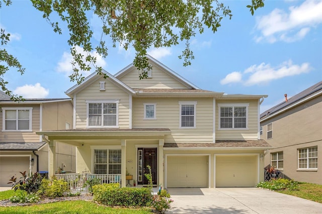 14231 Sonco Ave, Windermere, FL 34786 - view of front of house featuring a porch, concrete driveway, a garage, and a shingled roof