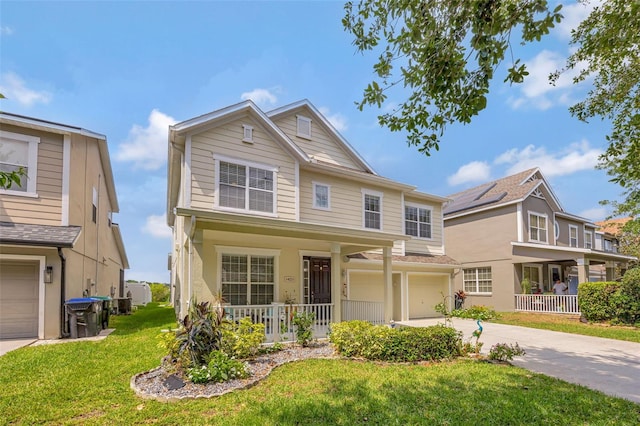 14231 Sonco Ave, Windermere, FL 34786 - view of front of home featuring covered porch, a garage, driveway, and a front lawn